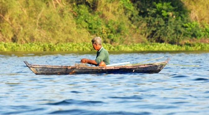 Fisherman in his canoe